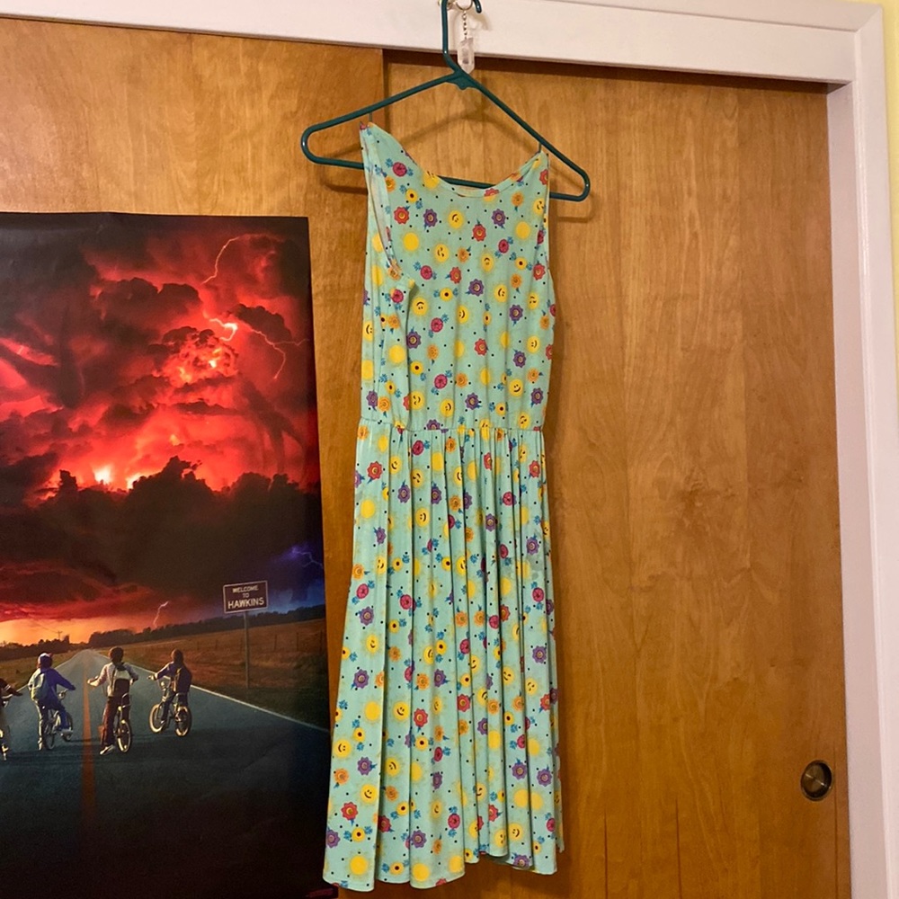 Teal dress. For teens or kids.